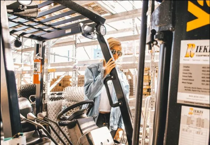 Forklift operator picking an order in a produce warehouse